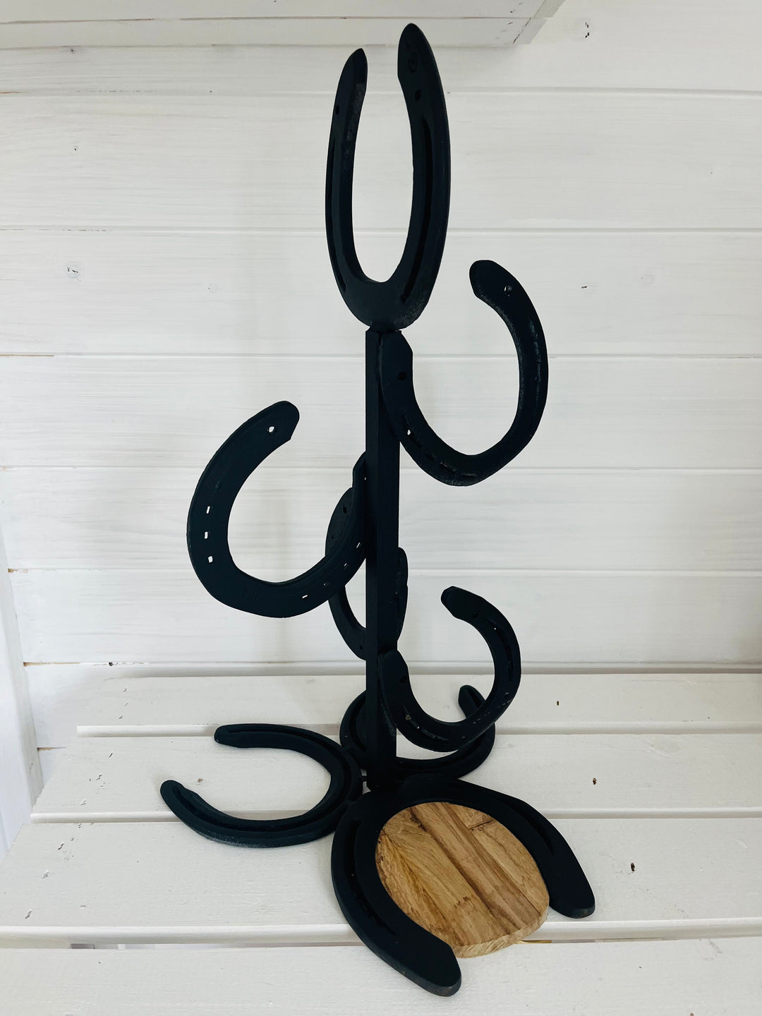 Unique whiskey stand made of horseshoes with a story